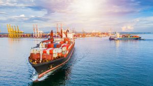 Container Ship Arriving In Commercial Port