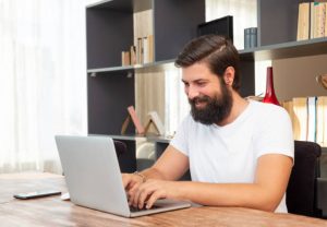 Handsome Man Working At Home, Modern Home.